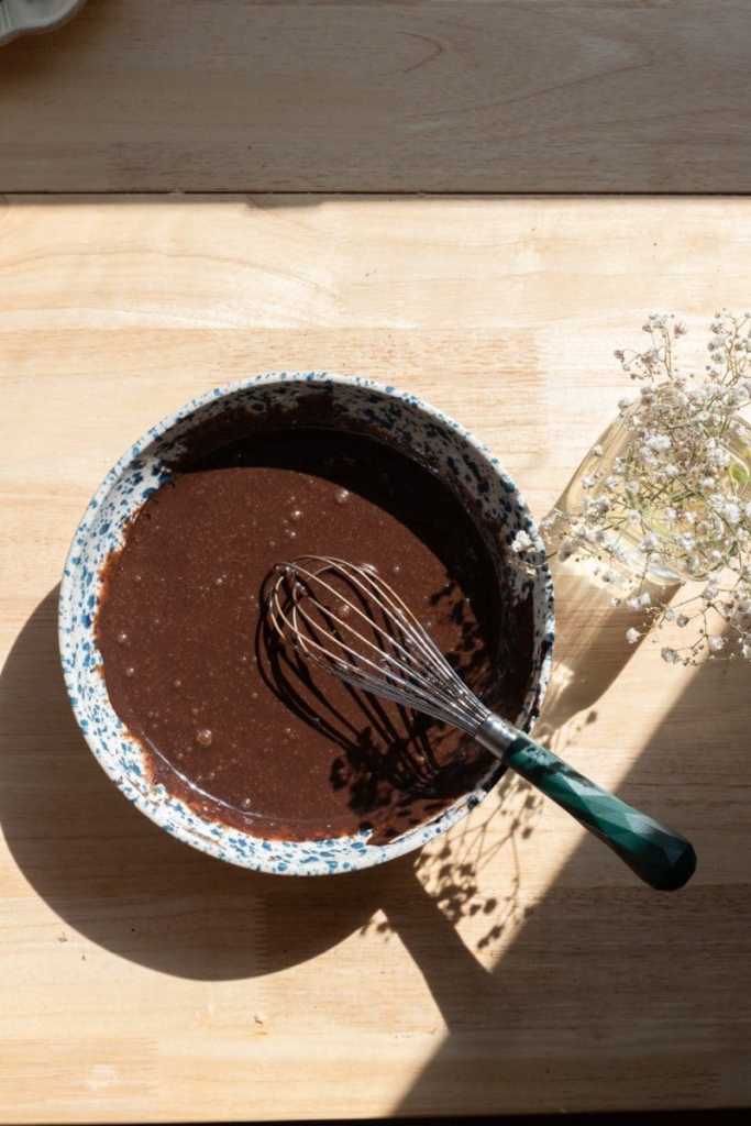 All of the wet ingredients whisked together in a mixing bowl.