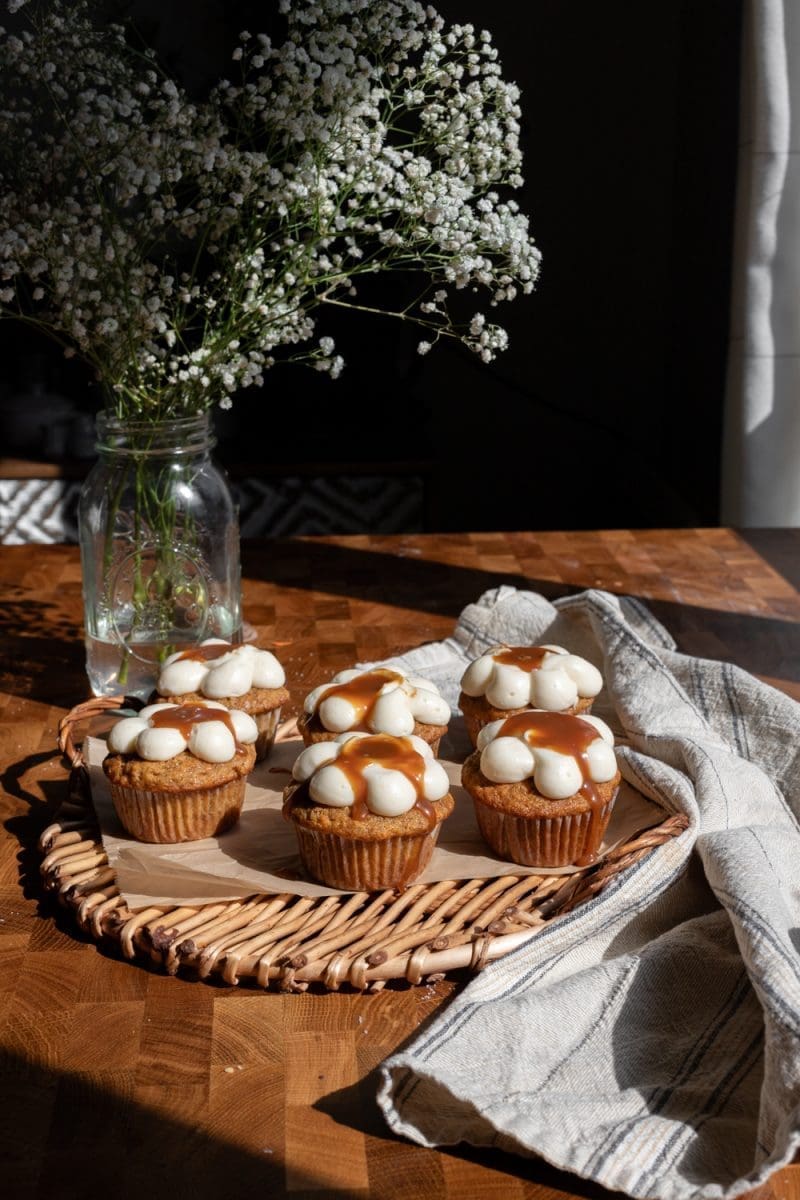 Carrot cake cupcakes on a tray.
