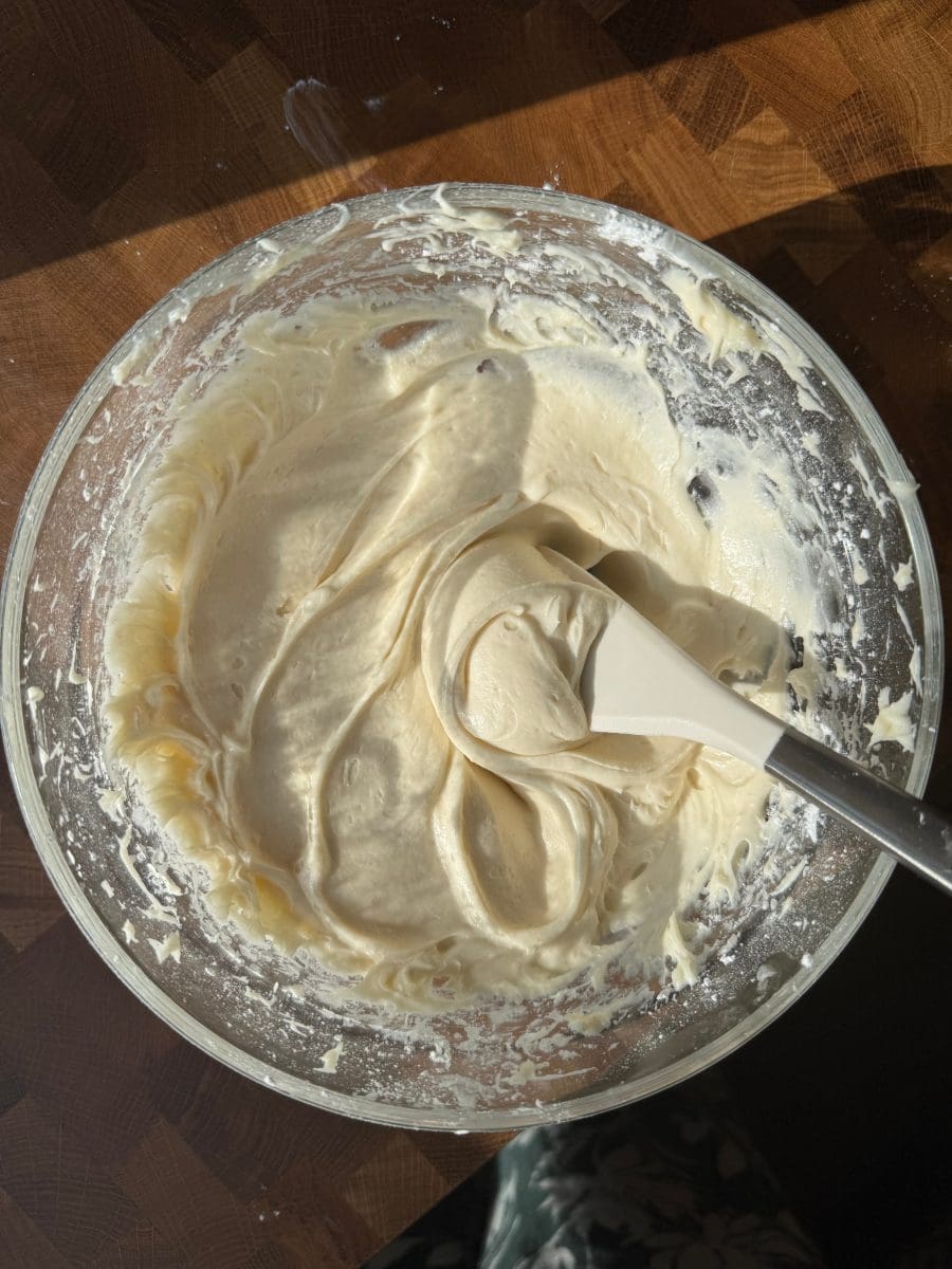 Brown butter cream cheese frosting in a mixing bowl.