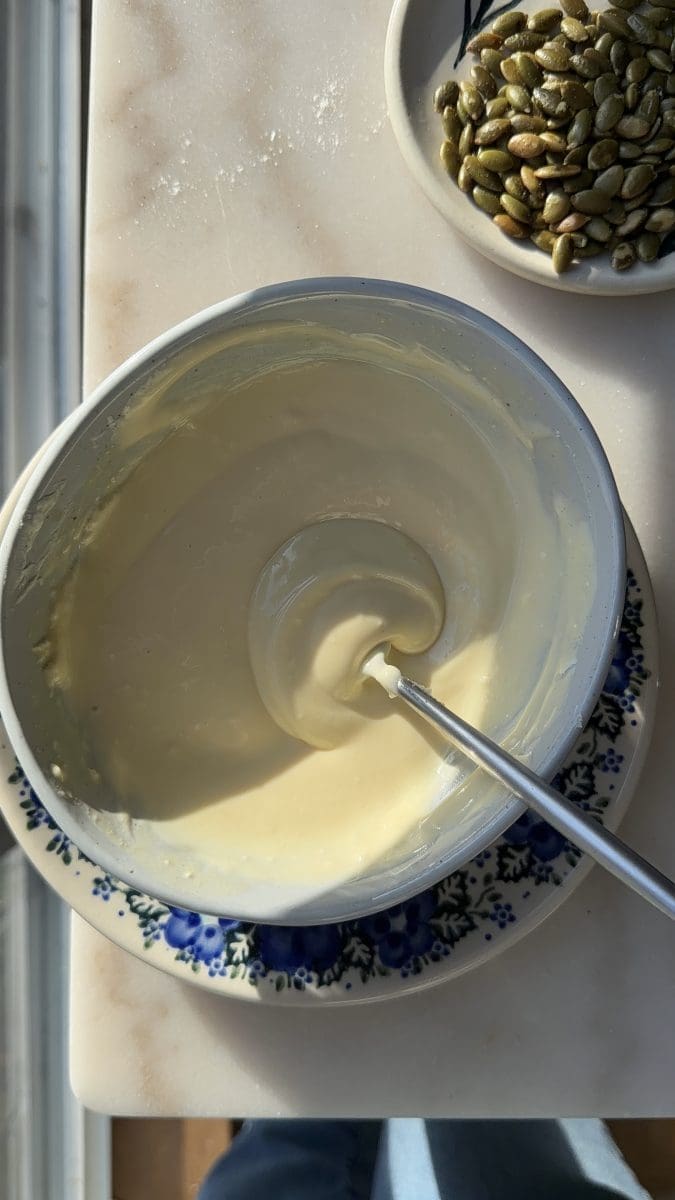 Cheesecake batter in a small mixing bowl.