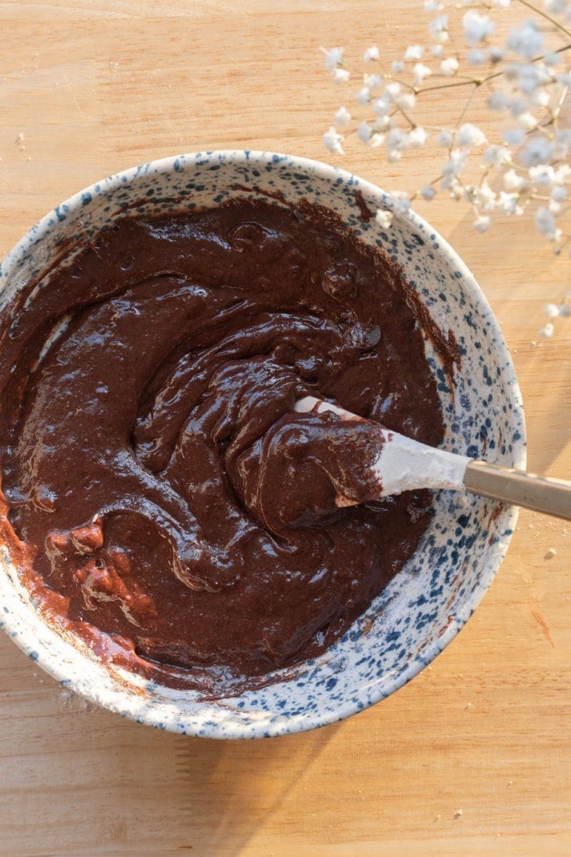 The finished brownie batter in a mixing bowl.