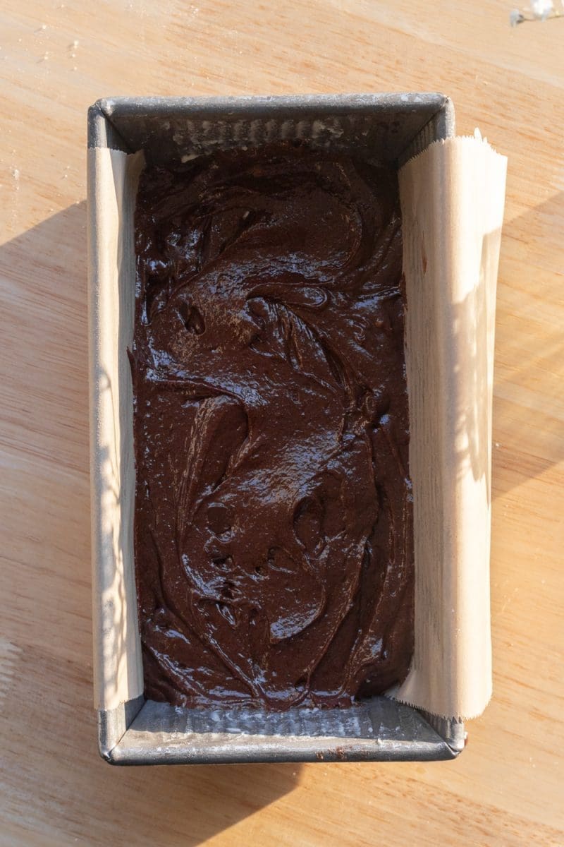 The brownie batter in a loaf pan.