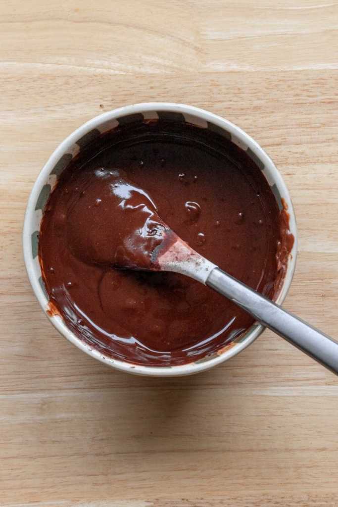 Melted chocolate and butter in a mixing bowl.
