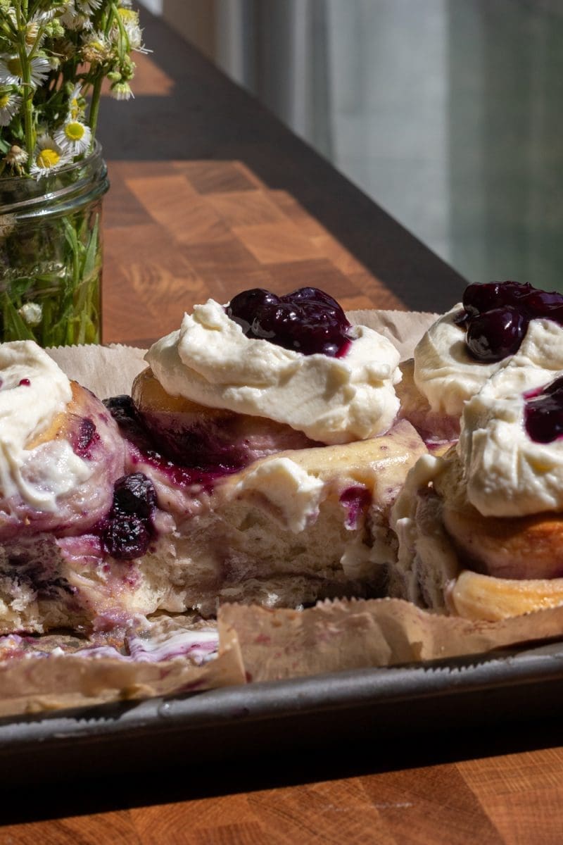 Close up of a milk bread blueberry sweet roll