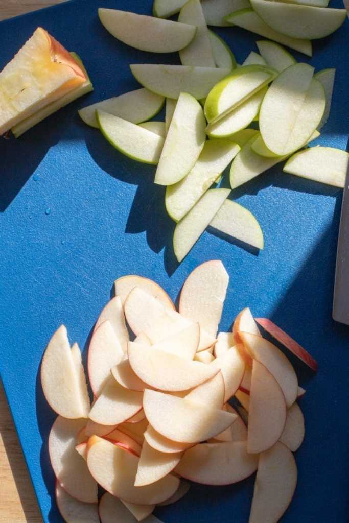 Sliced apples on a cutting board.