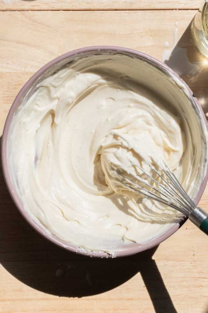 The cream cheese frosting in a mixing bowl.