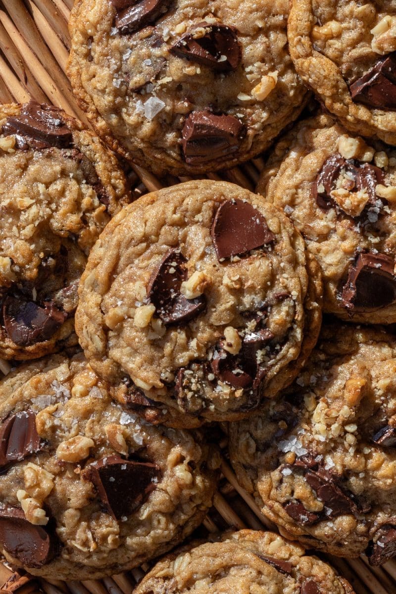 The banana bread chocolate chip cookies stacked on top of each other on a tray.
