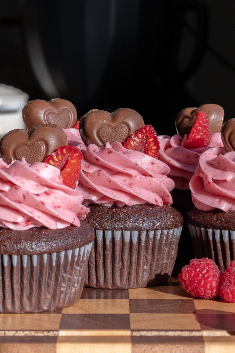 Close up of the frosted chocolate raspberry cupcakes.