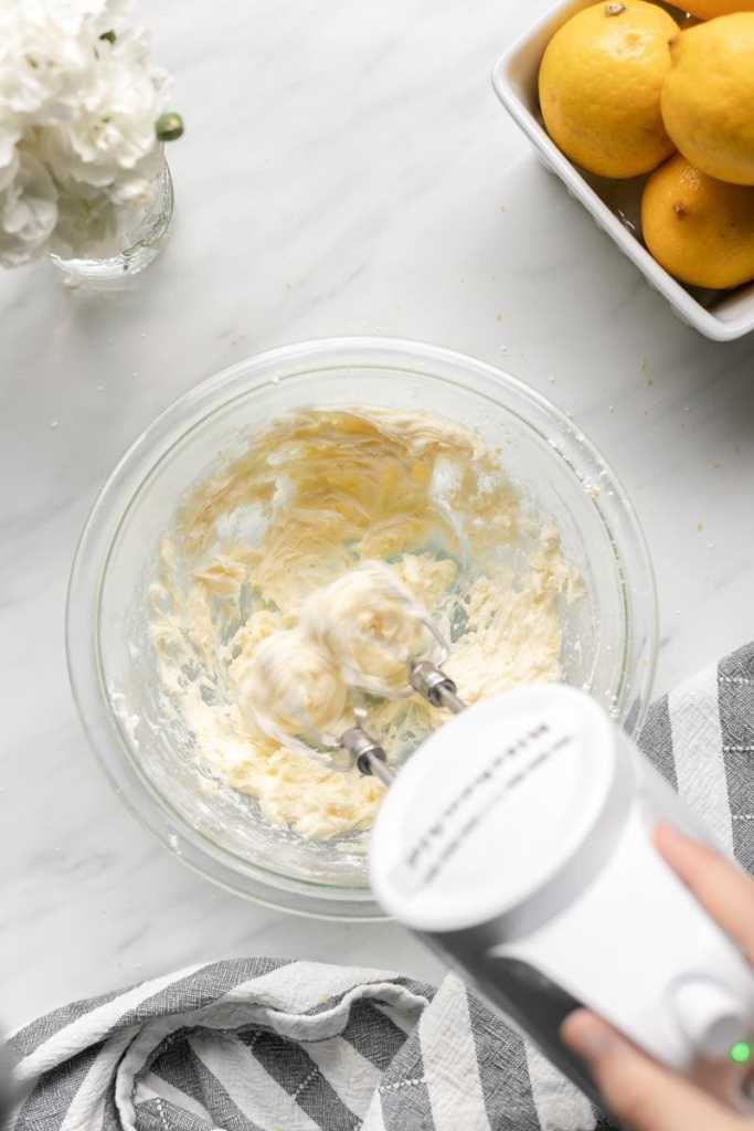 Beating the butter and sugar together.