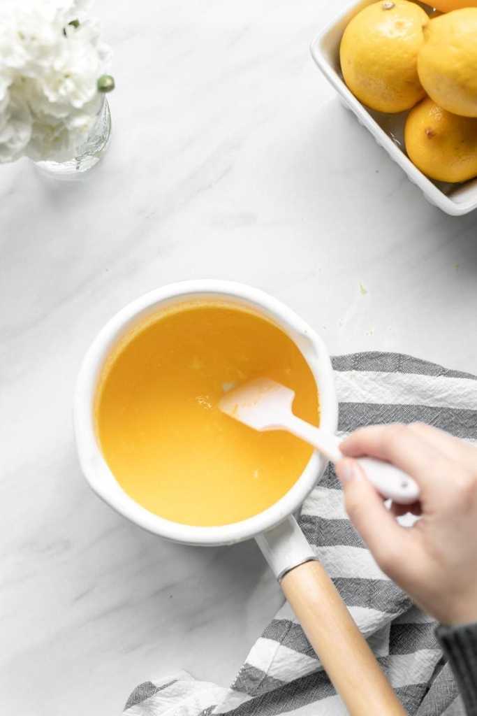 The lemon curd ingredients in a saucepan.