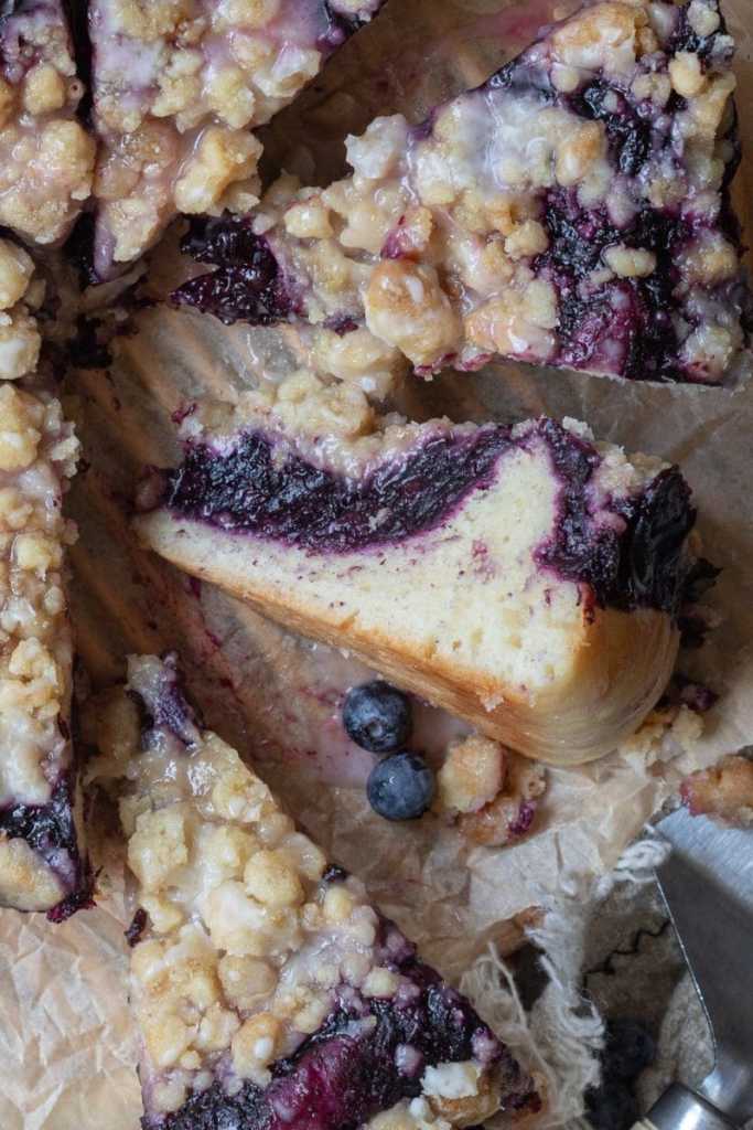 Close up of the cross-section of a slice of the blueberry brioche crumb cake