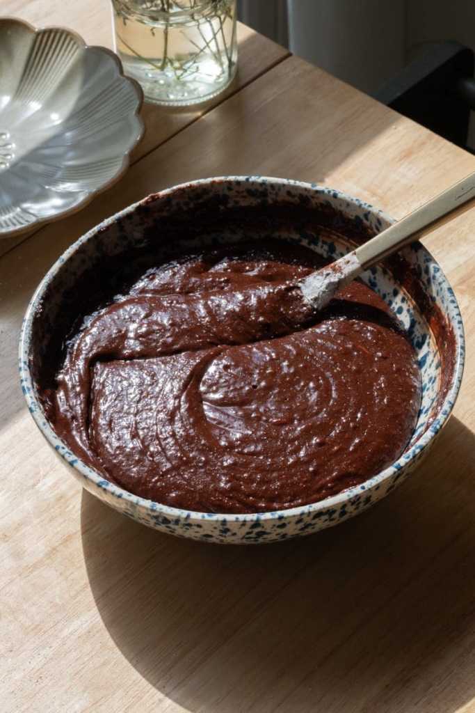The finished brownie batter in a mixing bowl.