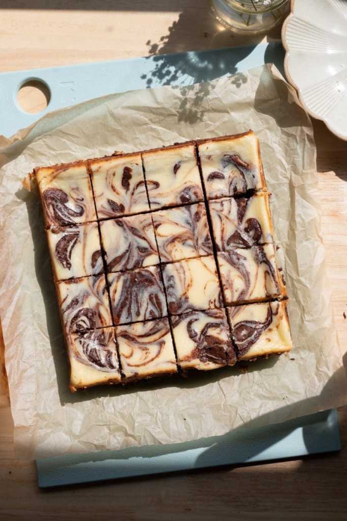 Full overhead view of the sliced cheesecake brownies. 