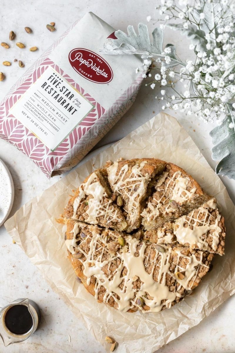 Picture of the pistachio coffee cake next to a coffee bag.