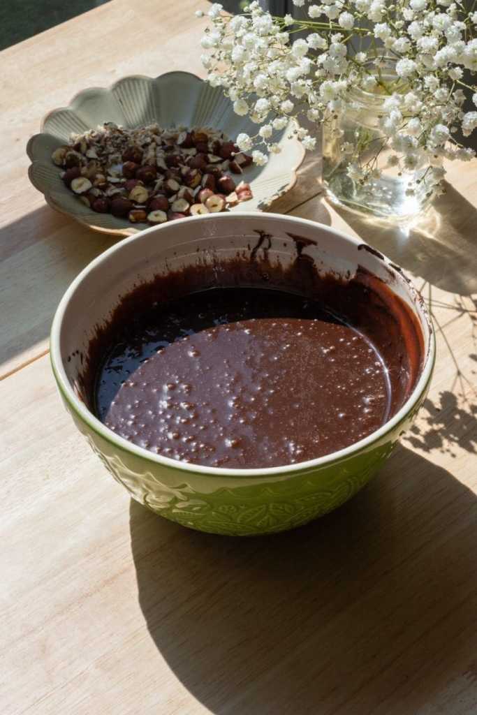 All of the wet ingredients for the chocolate loaf cake combined in a mixing bowl.