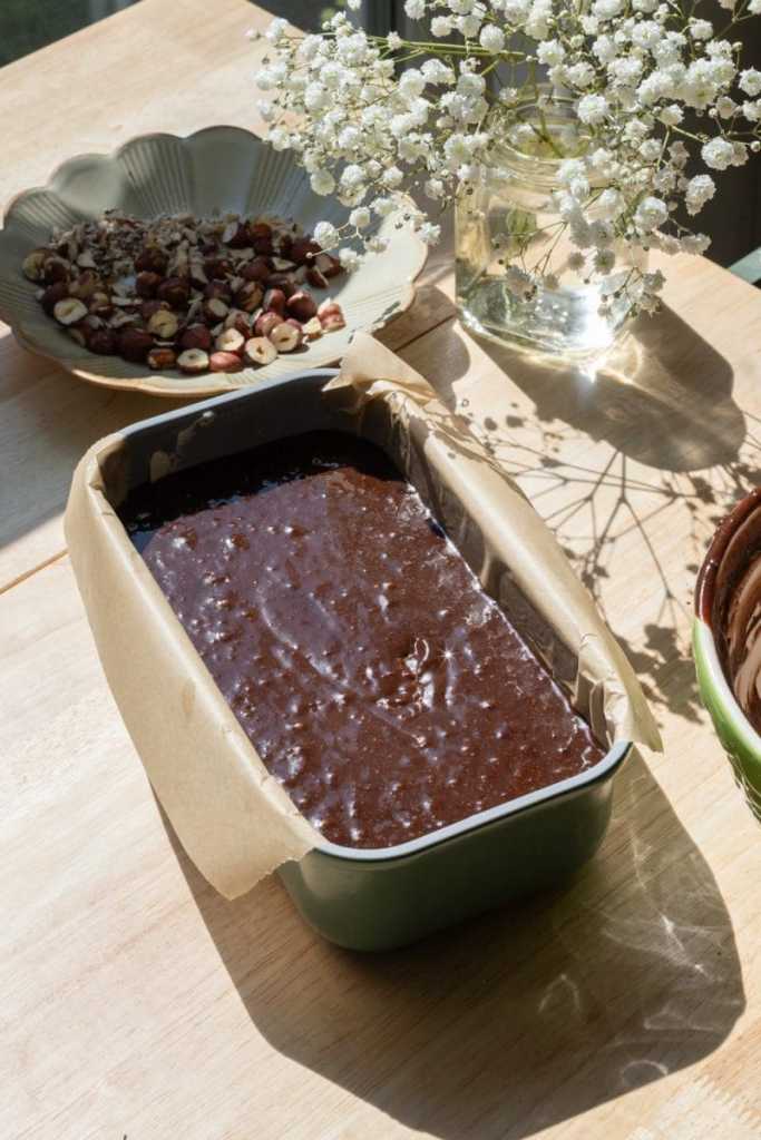 The chocolate loaf cake batter in a loaf pan, before baking.