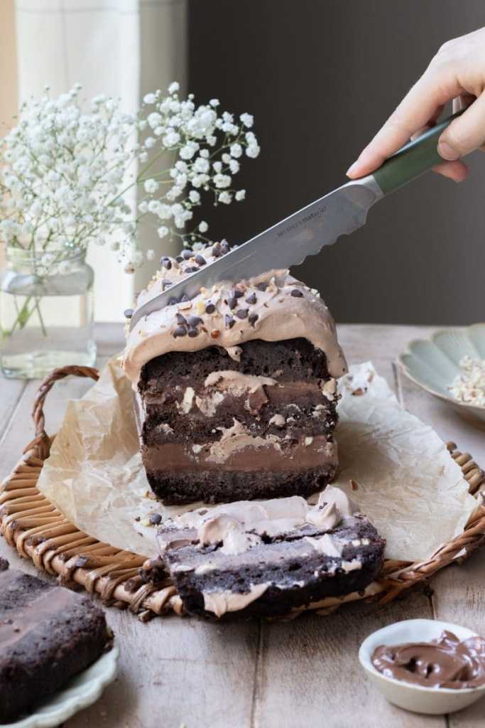 Slicing into the chocolate hazelnut ice cream cake.