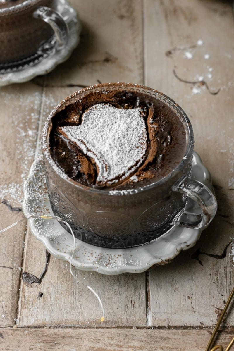 Close up of the dark chocolate mocha topped with a powdered sugar ghost stencil.