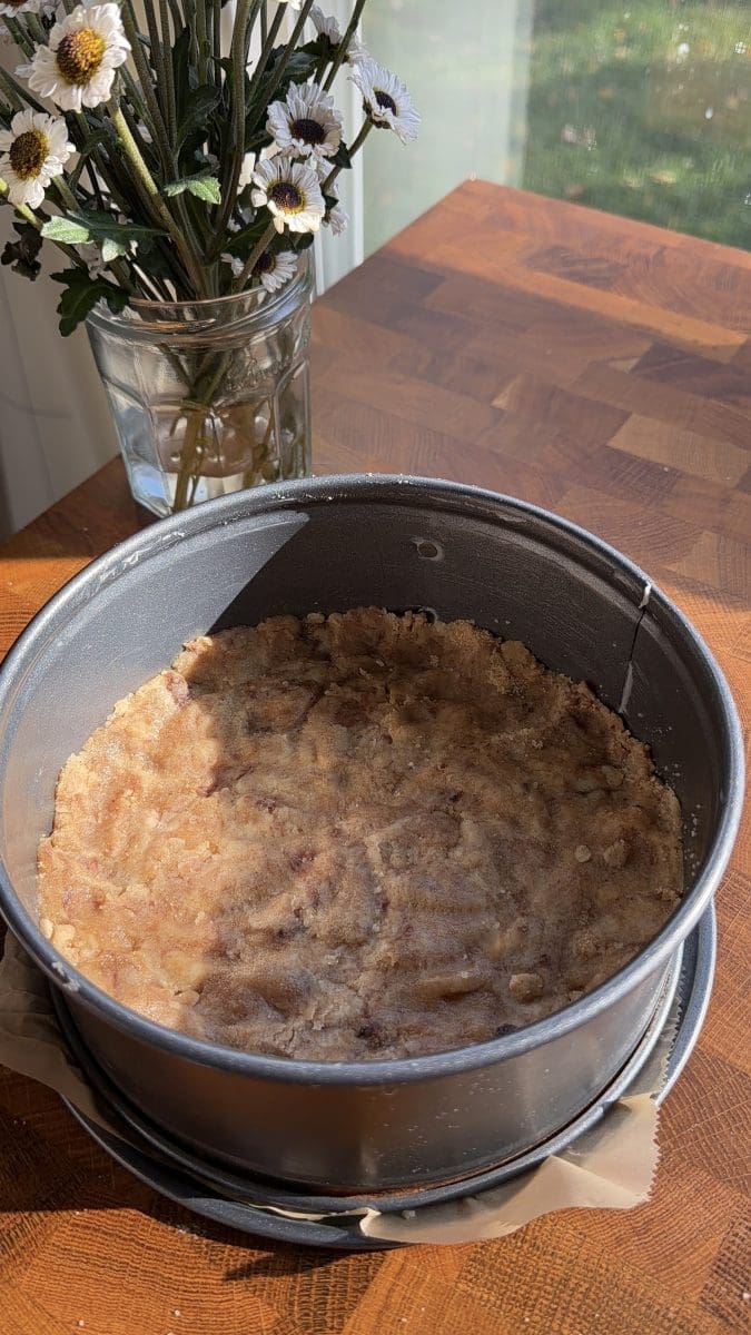 The shortbread patted down into a springform pan.