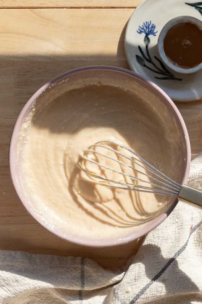 The cupcake batter in a mixing bowl.