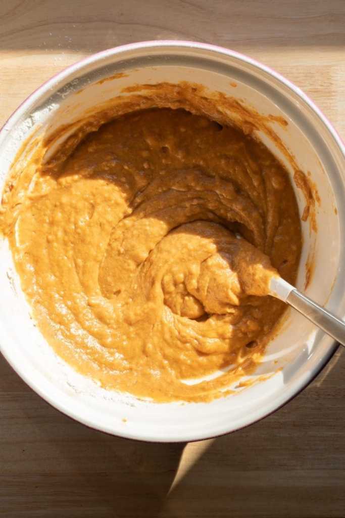 The finished pumpkin batter in a mixing bowl.