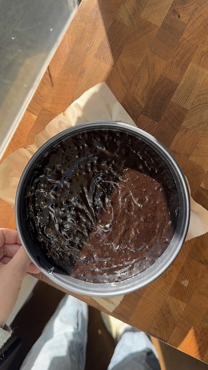 The cake batter in a springform pan.