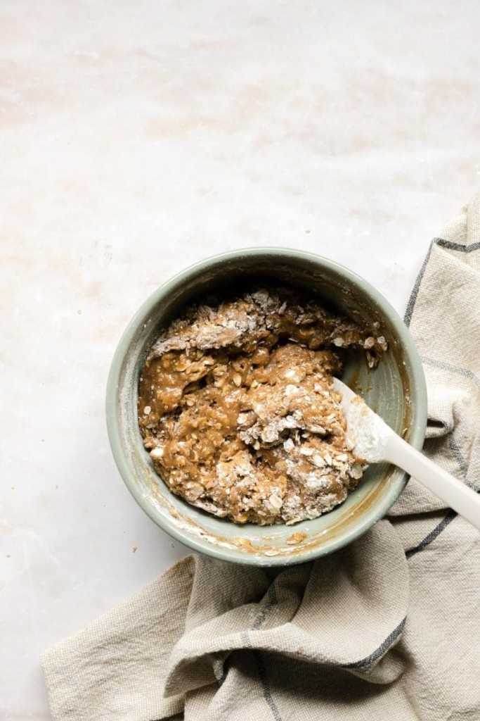 Folding the dry ingredients into the wet ingredients.