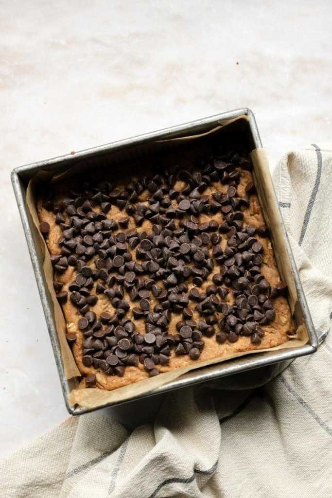 Chocolate chips on top of the cookie dough.