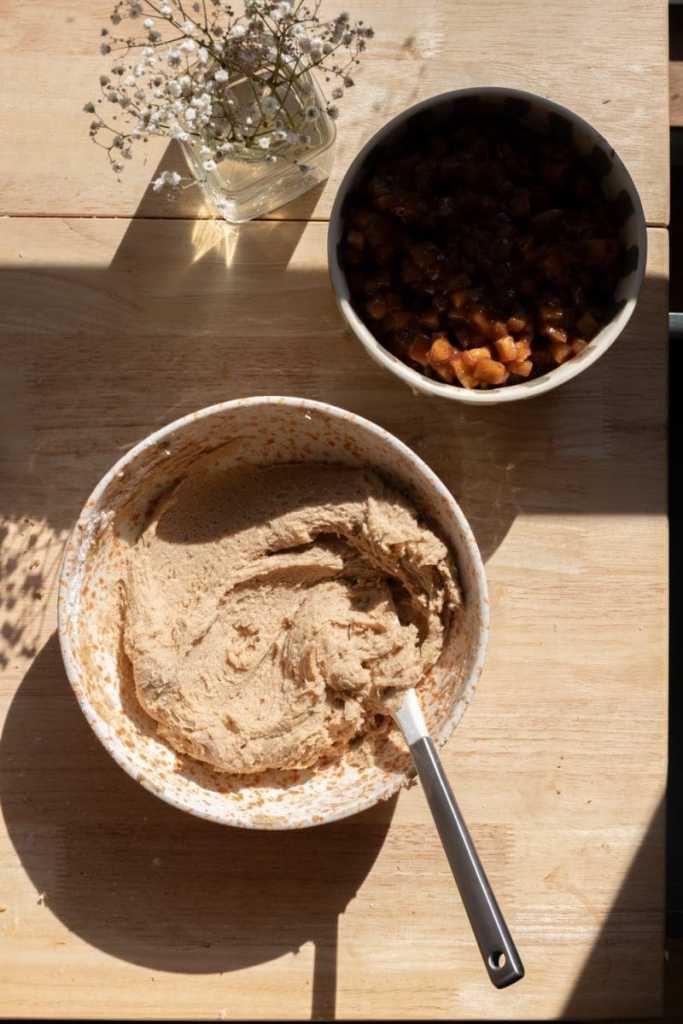The apple pie cookie dough in a mixing bowl.