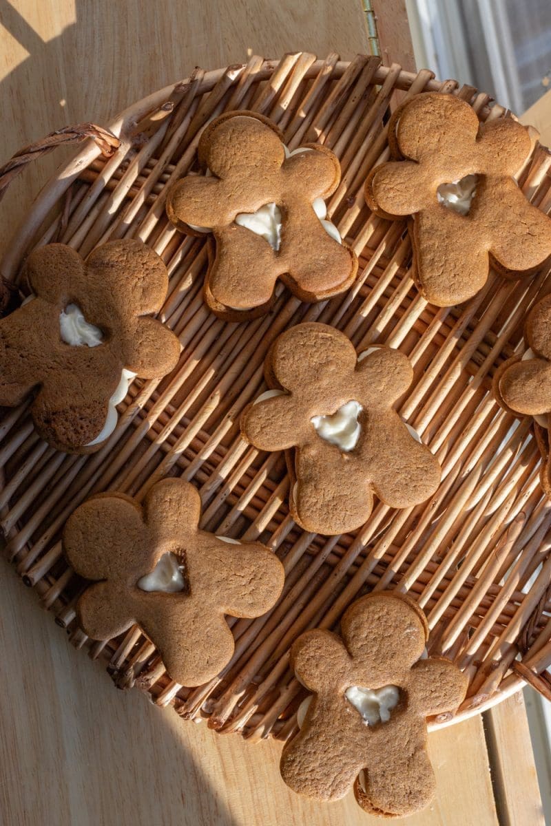 The filled gingerbread sandwich cookies on a tray.