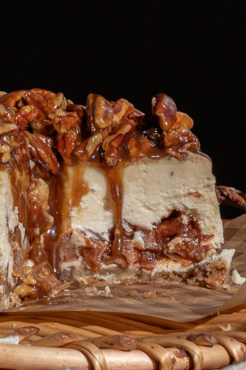 Close up slice of the apple pecan pie cheesecake.