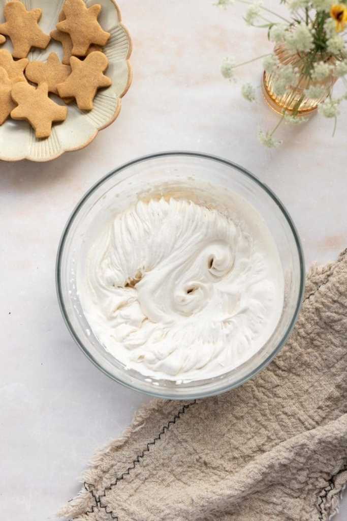The whipped cream whipped up in a bowl.