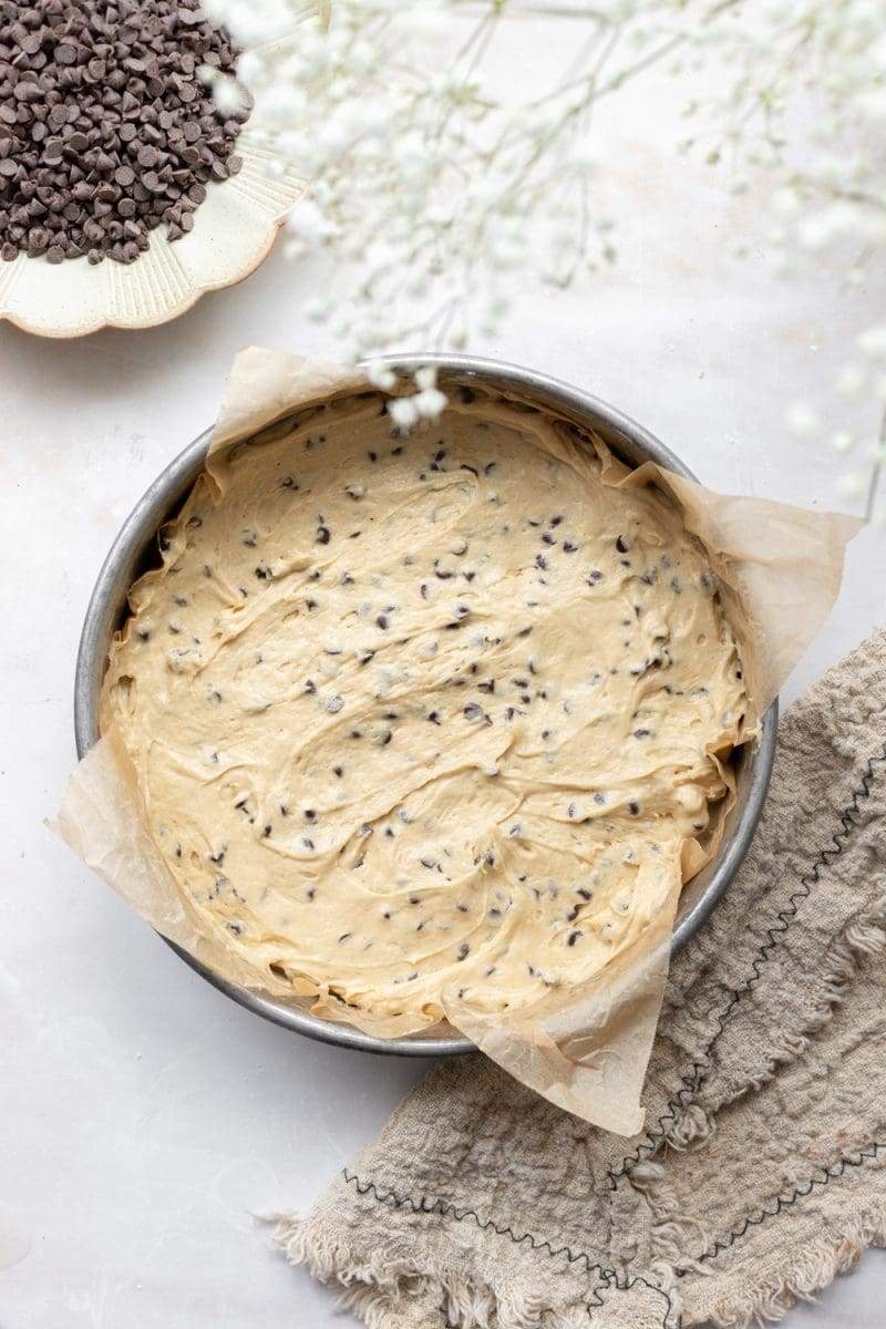 The hazelnut chocolate chip coffee cake in the baking pan, prior to being baked. The layer being shown is the chocolate chip coffee cake.