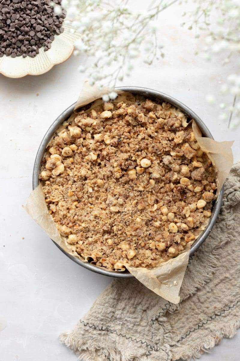 The hazelnut chocolate chip coffee cake in the baking pan, prior to being baked. The layer being shown is the hazelnut streusel.