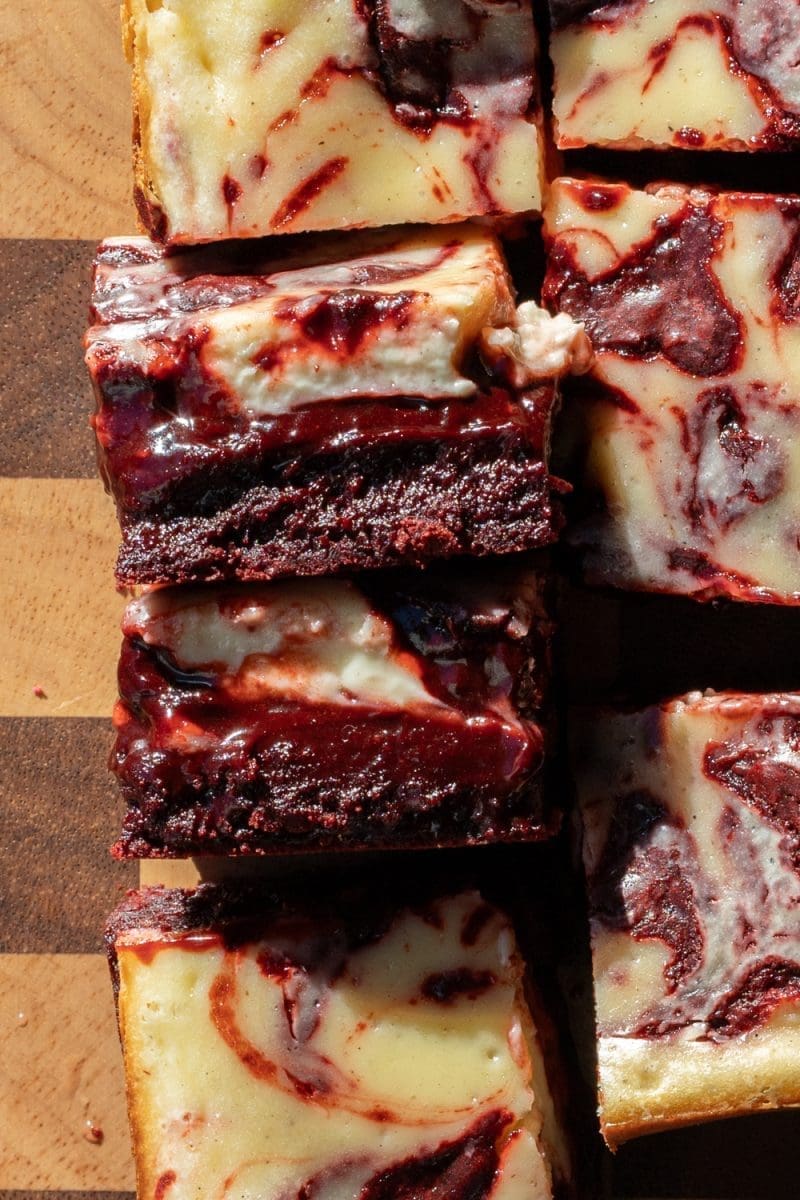 Close up cross-section of the red velvet cheesecake brownies.