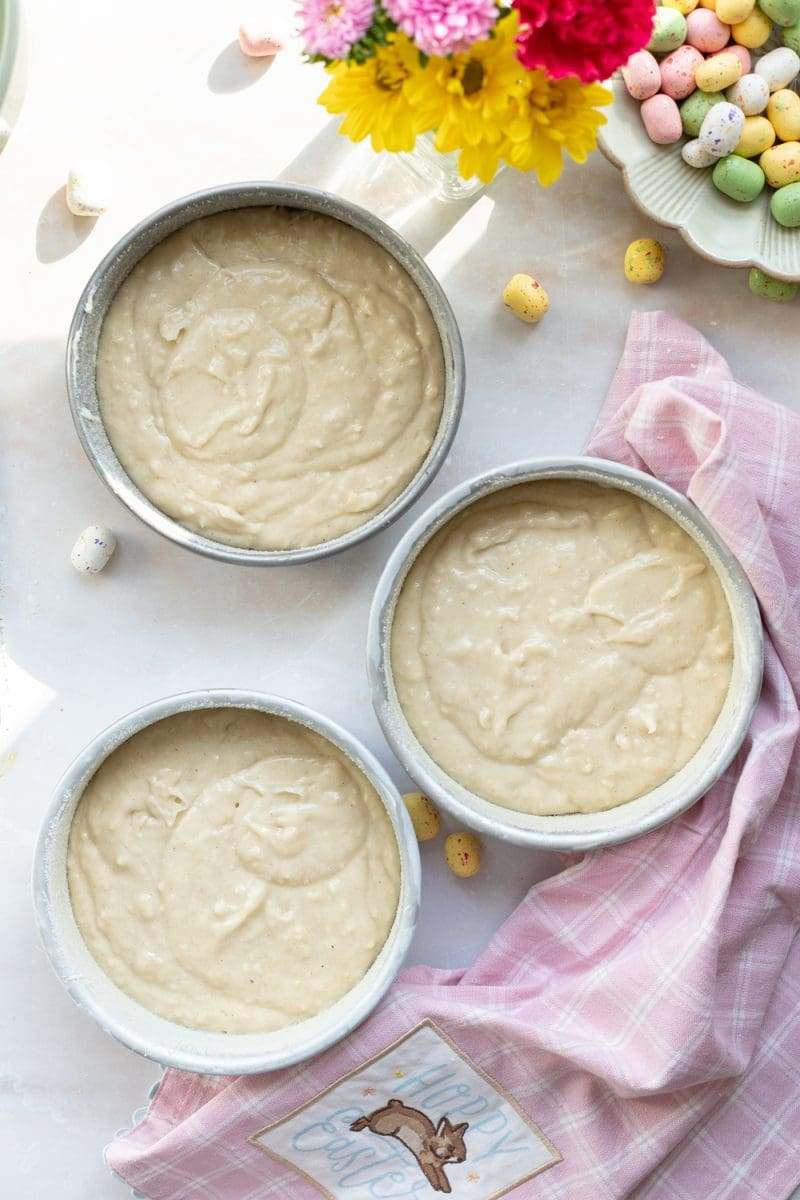 the cake batter split between three 6-inch pans