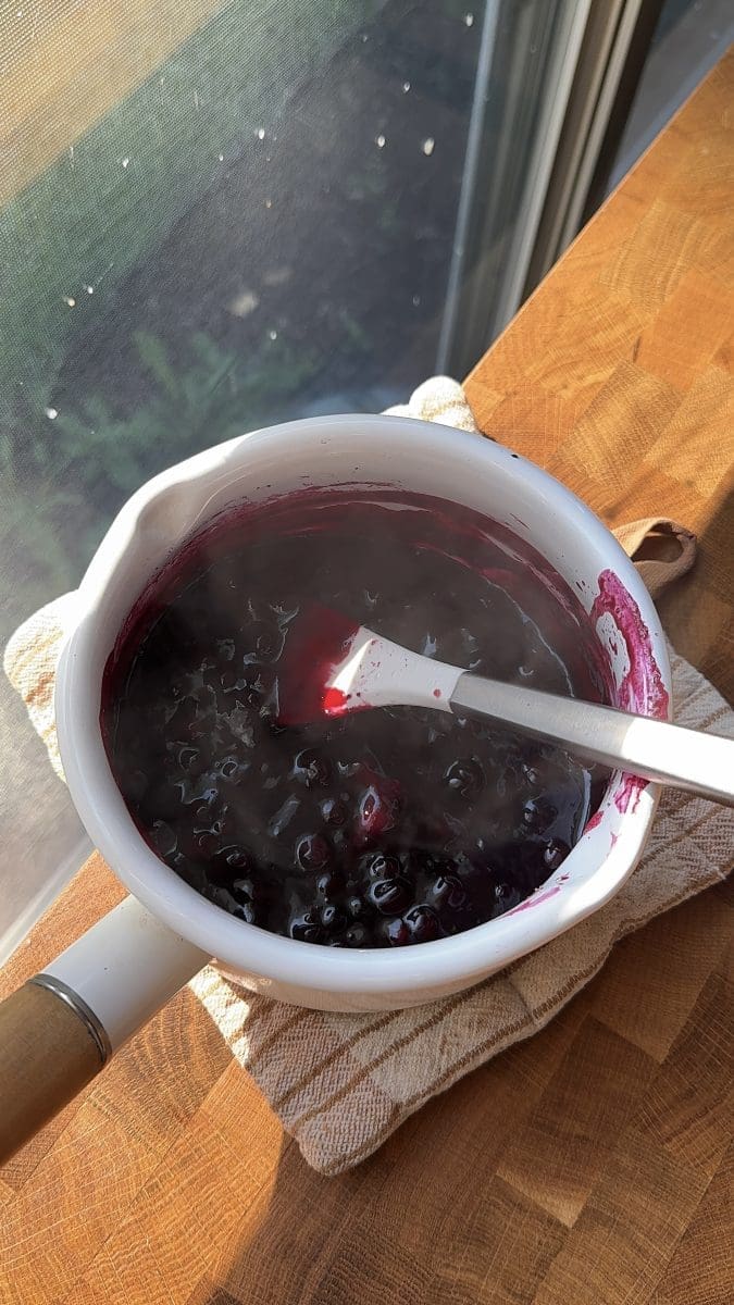 Wild blueberry jam in a saucepan.