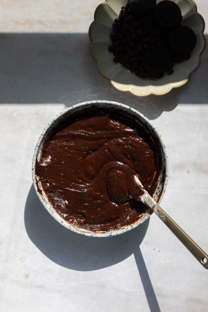 The finished brownie batter in a mixing bowl.
