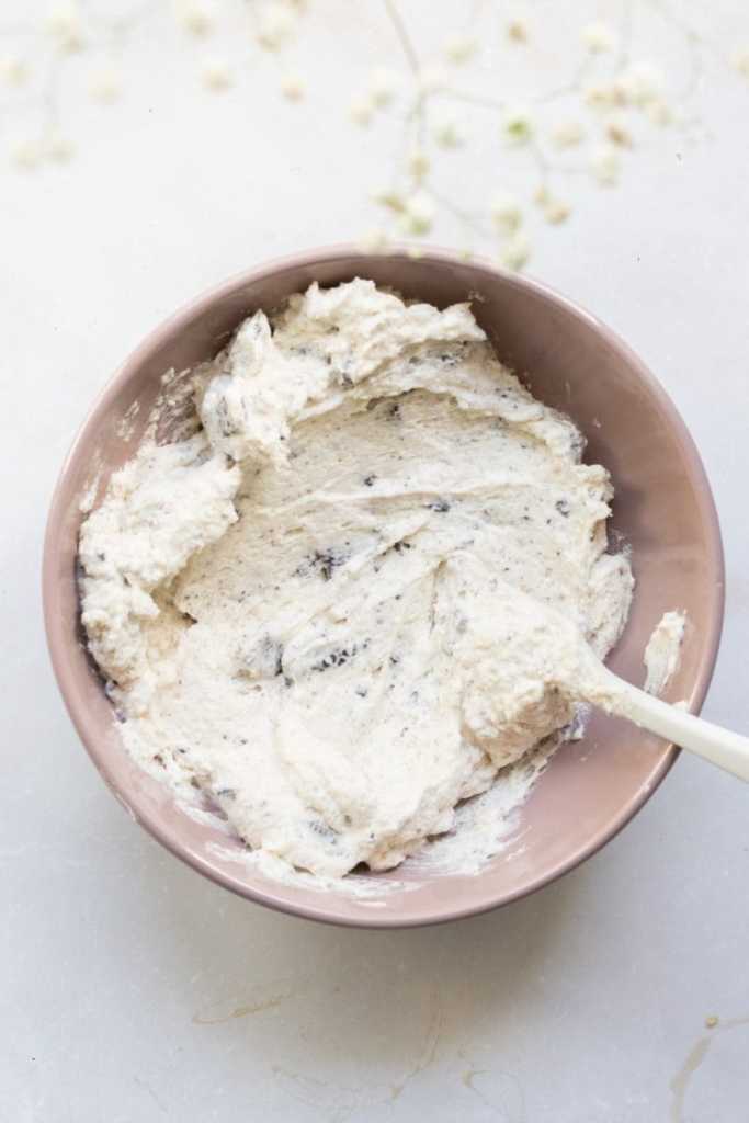 The whipped oreo buttercream in a mixing bowl.