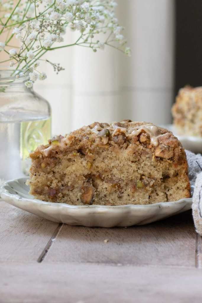 Close up of a slice of pistachio coffee cake.