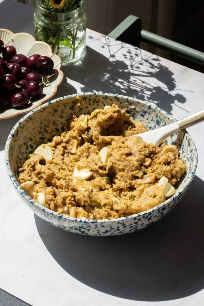 The finished pistachio cookie dough in a mixing bowl.