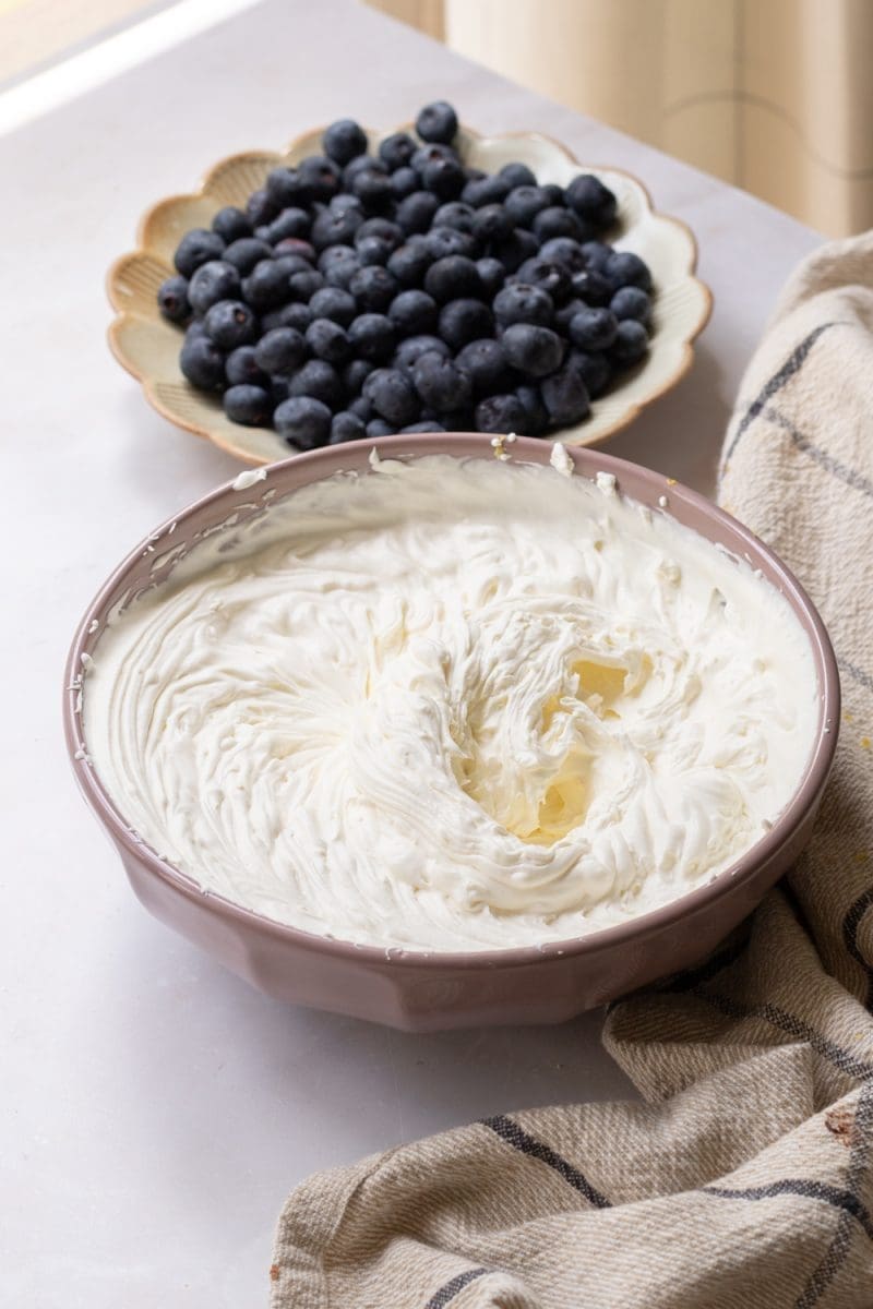 The mascarpone whipped cream in a mixing bowl.