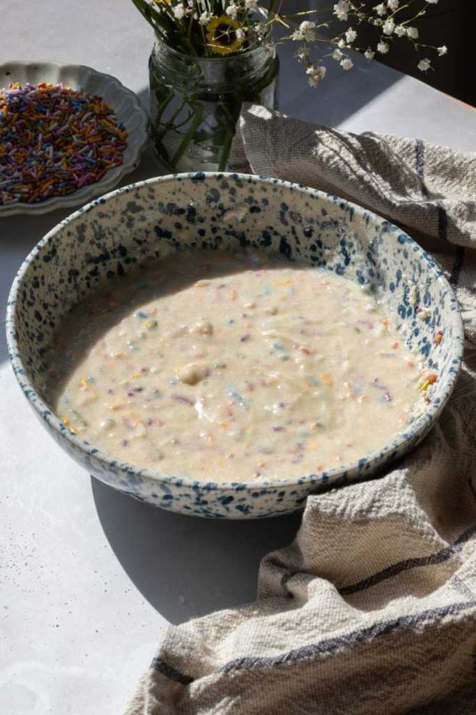 The finished cupcake batter in a mixing bowl.