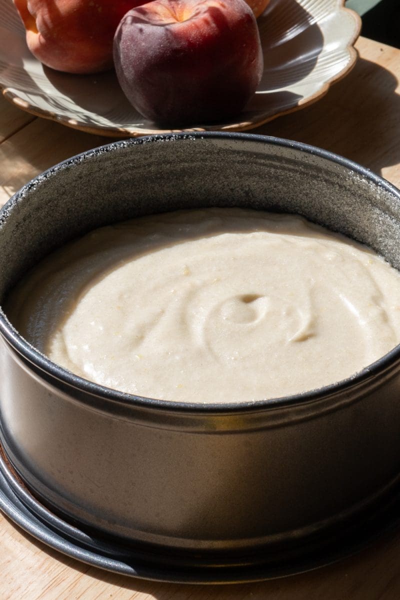 The cake batter in a springform pan, prior to baking.
