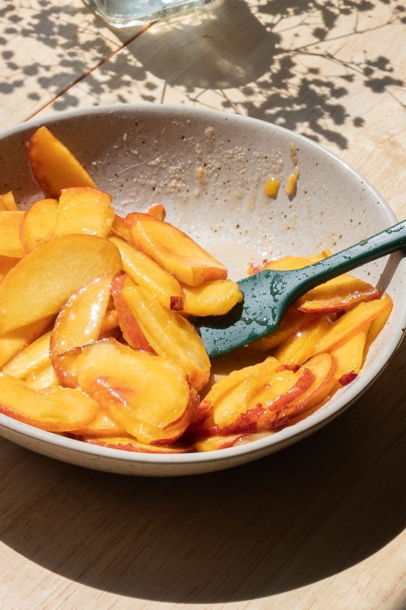The fresh peaches tossed with brown sugar and lemon juice.