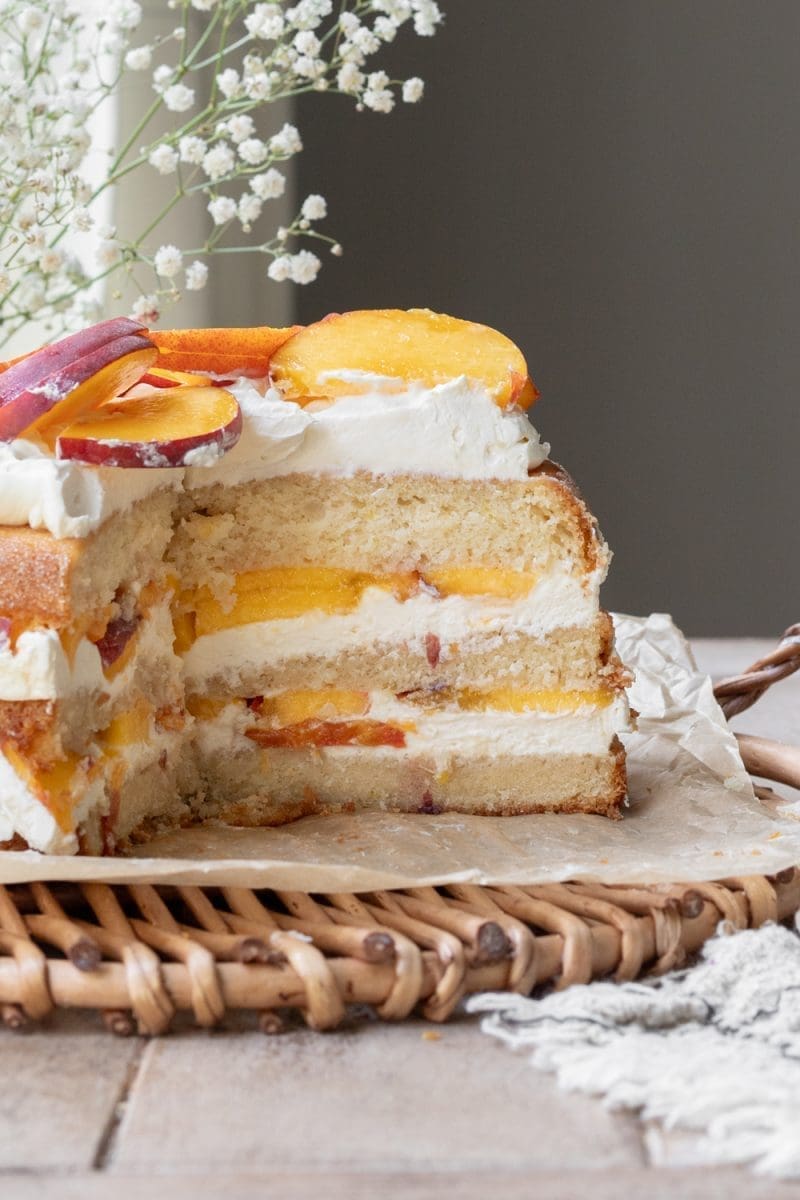 Close up cross-section of the peaches and cream cake