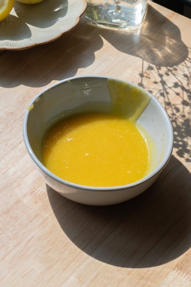 The finished lemon curd in a small mixing bowl.