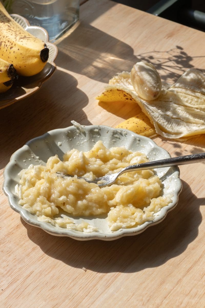 Mashed banana on a plate.