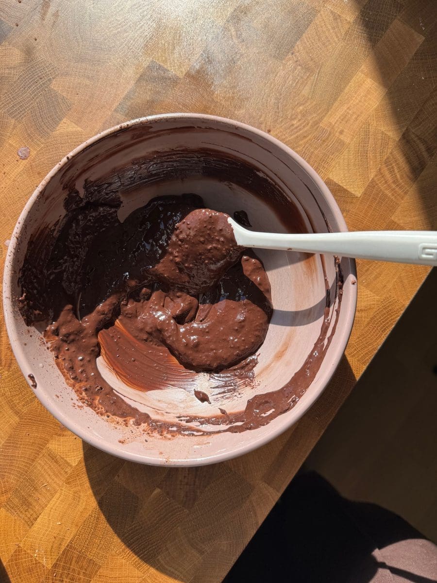 The cocoa and milk mixed together.