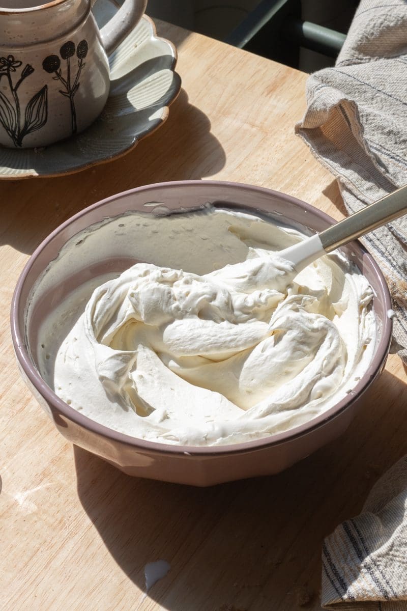 The mascarpone whipped cream in a mixing bowl.